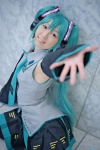aqua_eyes aqua_hair blouse cosplay detached_sleeves hatsune_miku headphones miki pleated_skirt skirt thighhighs tie twintails vocaloid rating:Safe score:0 user:pixymisa