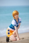 beach boots cosplay kuuya miniskirt nami_(one_piece) ocean one_piece orange_hair skirt tshirt rating:Safe score:1 user:nil!