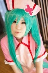 aqua_hair cosplay hatsune_miku midori_miyabi nurse nurse_cap nurse_uniform twintails vocaloid rating:Safe score:0 user:pixymisa
