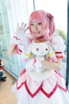 bows choker cosplay dress gloves hairbow kaname_madoka kujyou_konegi pink_hair plushie puella_magi_madoka_magica red_eyes tiered_skirt twintails rating:Safe score:0 user:pixymisa