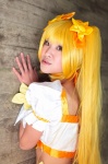 blonde_hair chin choker cosplay croptop cuffs cure_sunshine flowers heartcatch_precure! myoudouin_itsuki pretty_cure twintails yellow_eyes rating:Safe score:0 user:pixymisa