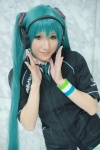 aqua_hair blouse cosplay green_eyes hatsune_miku headset jacket tie twintails vocaloid wakame wristband rating:Safe score:0 user:pixymisa