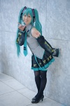 aqua_eyes aqua_hair blouse cosplay detached_sleeves hatsune_miku headphones miki pleated_skirt skirt thighhighs tie twintails vocaloid rating:Safe score:1 user:pixymisa