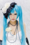 aqua_eyes aqua_hair cleavage cosplay dress elbow_gloves flower gloves hat hatsune_miku necklace rau_(cosplayer) twintails vocaloid rating:Safe score:0 user:pixymisa