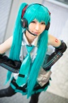 aqua_hair blouse cosplay detached_sleeves hatsune_miku headset pleated_skirt rinami skirt thighhighs tie twintails vocaloid rating:Safe score:2 user:nil!