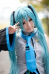 aqua_hair blouse cosplay detached_sleeves hatsune_miku headset pleated_skirt sanaka skirt tie twintails vocaloid rating:Safe score:0 user:pixymisa