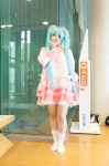 aqua_eyes aqua_hair cosplay dress hatsune_miku kneehighs tiered_skirt toko_(ii) twintails vocaloid rating:Safe score:0 user:pixymisa