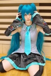 aqua_hair cosplay default_costume detached_sleeves hatsune_miku headset hina pleated_skirt skirt thighhighs tie twintails vocaloid zettai_ryouiki rating:Safe score:1 user:nil!