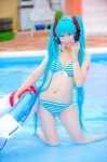 aqua_hair bikini cleavage cosplay hatsune_miku headset inner_tube mashiro_yuki pool project_diva swimsuit twintails vocaloid wet rating:Safe score:2 user:nil!