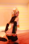 ass bed blonde_hair boots cosplay detached_sleeves hairbow headphones kagamine_rin panties panty_pull shorts tanaka_mana vocaloid rating:Questionable score:5 user:shiwahentai