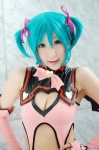 aqua_hair chii cleavage cosplay dress elbow_gloves fingerless_gloves gloves hairbows hatsune_miku project_diva twintails vocaloid wings world_is_mine_(vocaloid) rating:Safe score:3 user:nil!