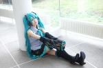 aqua_hair blouse cosplay detached_sleeves hatsune_miku headset kurou_sagi pleated_skirt skirt thighhighs tie twintails vocaloid zettai_ryouiki rating:Safe score:2 user:nil!