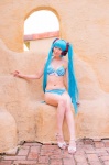 aqua_hair bikini cleavage cosplay hatsune_miku headset mashiro_yuki project_diva swimsuit twintails vocaloid rating:Safe score:0 user:nil!