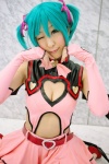 aqua_hair chii cleavage cosplay dress elbow_gloves fingerless_gloves gloves hairbows hatsune_miku project_diva stirrup_socks tail twintails vocaloid world_is_mine_(vocaloid) rating:Safe score:3 user:nil!