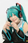 <3 aqua_hair blouse blue_eyes chica cosplay detached_sleeves hatsune_miku headset pleated_skirt skirt thighhighs twintails vocaloid rating:Safe score:0 user:pixymisa