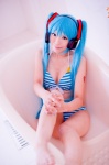 aqua_hair bathroom bathtub bikini cleavage cosplay hatsune_miku headset mashiro_yuki project_diva swimsuit twintails vocaloid rating:Safe score:0 user:nil!