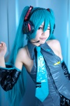 aqua_hair blouse blue_eyes cosplay dai detached_sleeves hatsune_miku headset pleated_skirt skirt twintails vocaloid rating:Safe score:1 user:pixymisa