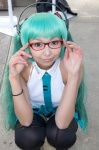 aqua_hair cosplay glasses hatsune_miku headphones necoco pleated_skirt skirt sleeveless_blouse thighhighs tie twintails vocaloid rating:Safe score:1 user:pixymisa