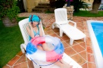 aqua_hair bikini cleavage cosplay hatsune_miku headset inner_tube mashiro_yuki pool project_diva swimsuit twintails vocaloid rating:Safe score:0 user:nil!
