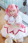 bows choker cosplay dress gloves hairbow kaname_madoka kneehighs kujyou_konegi pink_hair plushie puella_magi_madoka_magica red_eyes tiered_skirt twintails rating:Safe score:0 user:pixymisa