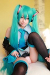 aqua_hair arai_yomi bed blouse cosplay detached_sleeves hatsune_miku headset panties pleated_skirt skirt thighhighs tie twintails vocaloid rating:Safe score:2 user:nil!