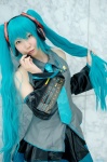 aqua_hair blouse cosplay detached_sleeves hatsune_miku headset kei pleated_skirt skirt tie twintails vocaloid rating:Safe score:0 user:nil!