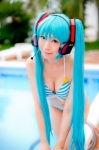 aqua_hair bikini cleavage cosplay hatsune_miku headset mashiro_yuki pool project_diva swimsuit twintails vocaloid rating:Safe score:3 user:nil!