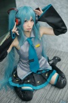 aqua_hair blouse cosplay detached_sleeves hatsune_miku headset mitsubachi_marie pleated_skirt skirt thighhighs tie twintails vocaloid zettai_ryouiki rating:Safe score:0 user:nil!