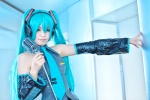 aqua_hair blouse blue_eyes cosplay dai detached_sleeves hatsune_miku headset microphone pleated_skirt skirt twintails vocaloid rating:Safe score:0 user:pixymisa