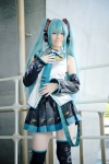 aqua_hair blouse cosplay detached_sleeves hatsune_miku headset pleated_skirt popuri skirt thighhighs tie twintails vocaloid zettai_ryouiki rating:Safe score:2 user:nil!