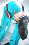 aqua_hair cosplay default_costume detached_sleeves hatsune_miku headset iori pleated_skirt skirt tie twintails vocaloid rating:Safe score:0 user:nil!