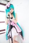 aqua_hair choker cosplay dress garter hairband hatsune_miku microphone momoiro_reku twintails vocaloid rating:Safe score:4 user:nil!