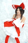 cosplay detached_sleeves dress dress_lift hairbow hakurei_reimu kishigami_hana miko thighhighs touhou rating:Safe score:0 user:nil!