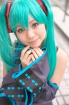 aqua_hair cosplay default_costume detached_sleeves hatsune_miku headset pleated_skirt skirt thighhighs tie twintails vocaloid yaya rating:Safe score:1 user:nil!