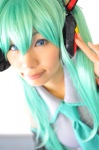 aqua_hair cosplay default_costume detached_sleeves hatsune_miku headset tenko tie twintails vocaloid rating:Safe score:0 user:nil!