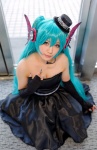 aqua_hair cleavage cosplay dress elbow_gloves fingerless_gloves gloves hatsune_miku headset strapless top_hat twintails vocaloid yane rating:Safe score:2 user:pixymisa