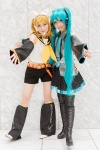 aqua_hair blonde_hair blouse boots cosplay detached_sleeves hairbow hatsune_miku headset hiokichi kagamine_rin leggings mineo_kana pantyhose pleated_skirt scarf shorts skirt thigh_boots thighhighs tie twintails vocaloid zettai_ryouiki rating:Safe score:0 user:pixymisa