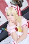 bed blonde_hair blouse cosplay flandre_scarlet hat irori touhou vest wings rating:Safe score:1 user:nil!