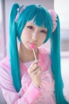 aqua_eyes aqua_hair bow cosplay dress hatsune_miku lollipop seri twintails vocaloid rating:Safe score:0 user:pixymisa