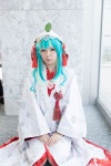 aqua_eyes cosplay hatsune_miku hood maitako multi-colored_hair robe tassels vocaloid rating:Safe score:1 user:pixymisa