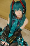 aqua_hair cosplay default_costume detached_sleeves haruka hatsune_miku headset pleated_skirt skirt thighhighs tie twintails vocaloid rating:Safe score:0 user:nil!
