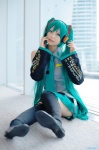 aqua_hair beng cosplay default_costume detached_sleeves hatsune_miku headset pleated_skirt skirt thighhighs tie twintails vocaloid zettai_ryouiki rating:Safe score:0 user:nil!