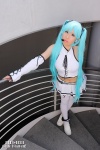 aqua_hair cosplay detached_sleeves hair_ribbons hatsune_miku microphone miniskirt nei project_diva skirt thighhighs twintails vocaloid rating:Safe score:1 user:pixymisa