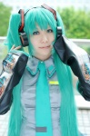 aqua_hair cosplay default_costume detached_sleeves hatsune_miku headset kureha_marie tie twintails vocaloid rating:Safe score:0 user:nil!