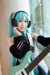 aqua_hair cosplay detached_sleeves guitar hatsune_miku headset miniskirt skirt tie twintails vocaloid yuki_nano rating:Safe score:0 user:pixymisa