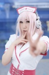 cosplay dress headphones kousuke nitro_super_sonic nurse nurse_cap nurse_uniform pink_hair super_soniko rating:Safe score:0 user:nil!