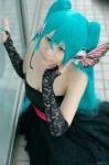 aiba_ai aqua_hair cleavage cosplay dress elbow_gloves fingerless_gloves gloves hatsune_miku headset magnet_(vocaloid) twintails vocaloid rating:Safe score:1 user:nil!