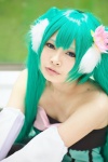 aqua_eyes bow cosplay detached_sleeves dress flower green_hair hatsune_miku headdress kai_(ii) thighhighs twintails vocaloid rating:Safe score:0 user:pixymisa