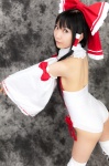 ass boots cosplay detached_sleeves hairbow hakurei_reimu kneepads lenfried miko one-piece_swimsuit swimsuit thighhighs touhou rating:Safe score:0 user:nil!