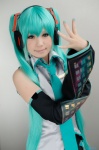 aqua_hair cosplay default_costume detached_sleeves hatsune_miku headset pleated_skirt skirt tie twintails vocaloid rating:Safe score:0 user:nil!